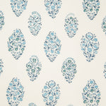 Detail of fabric in a floral paisley print in shades of blue and green on a cream field.