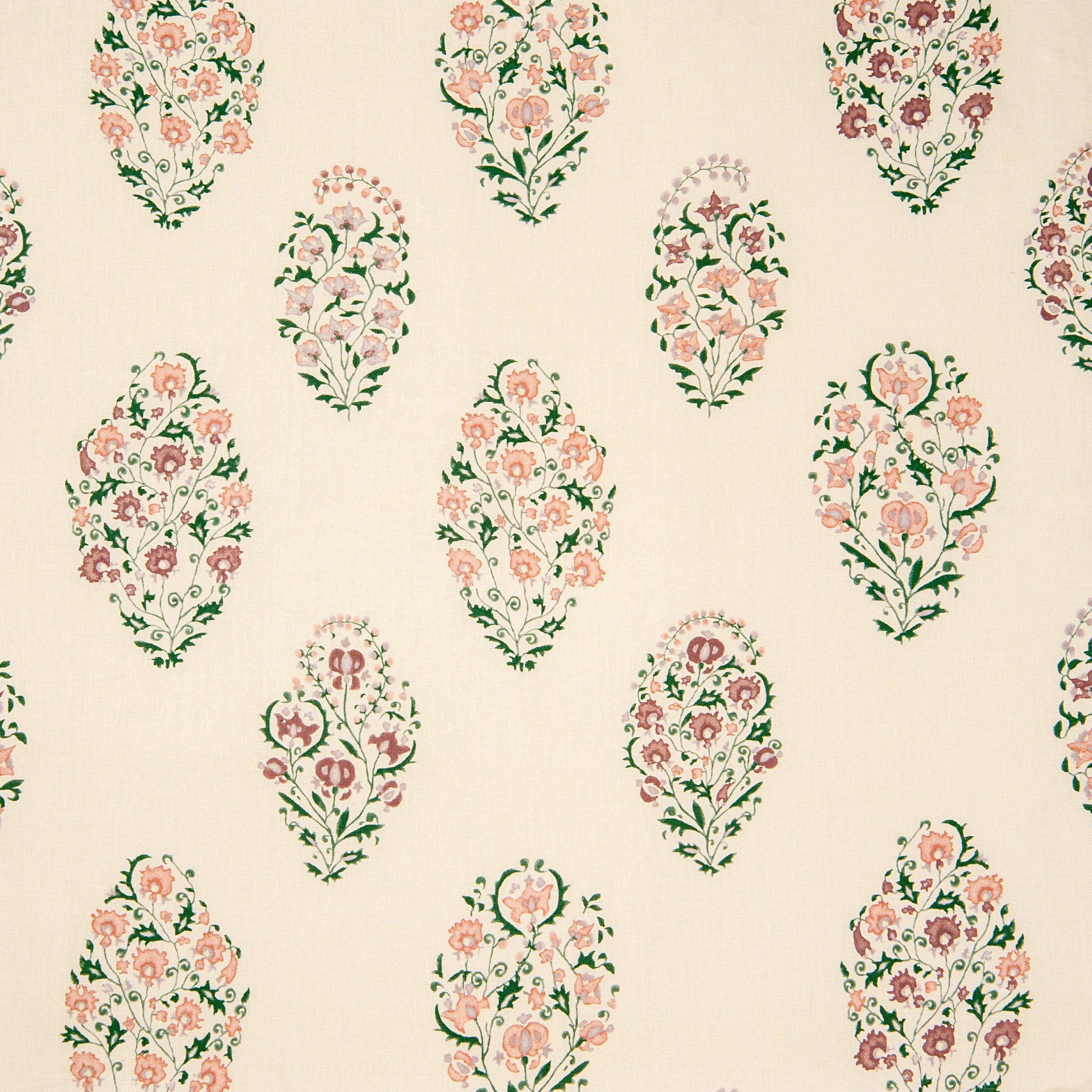 Detail of fabric in a floral paisley print in shades of pink, purple and green on a cream field.