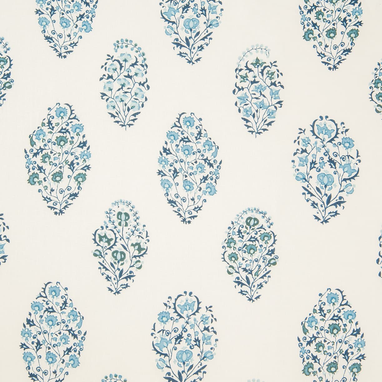 Detail of wallpaper in a floral paisley print in shades of blue and green on a cream field.