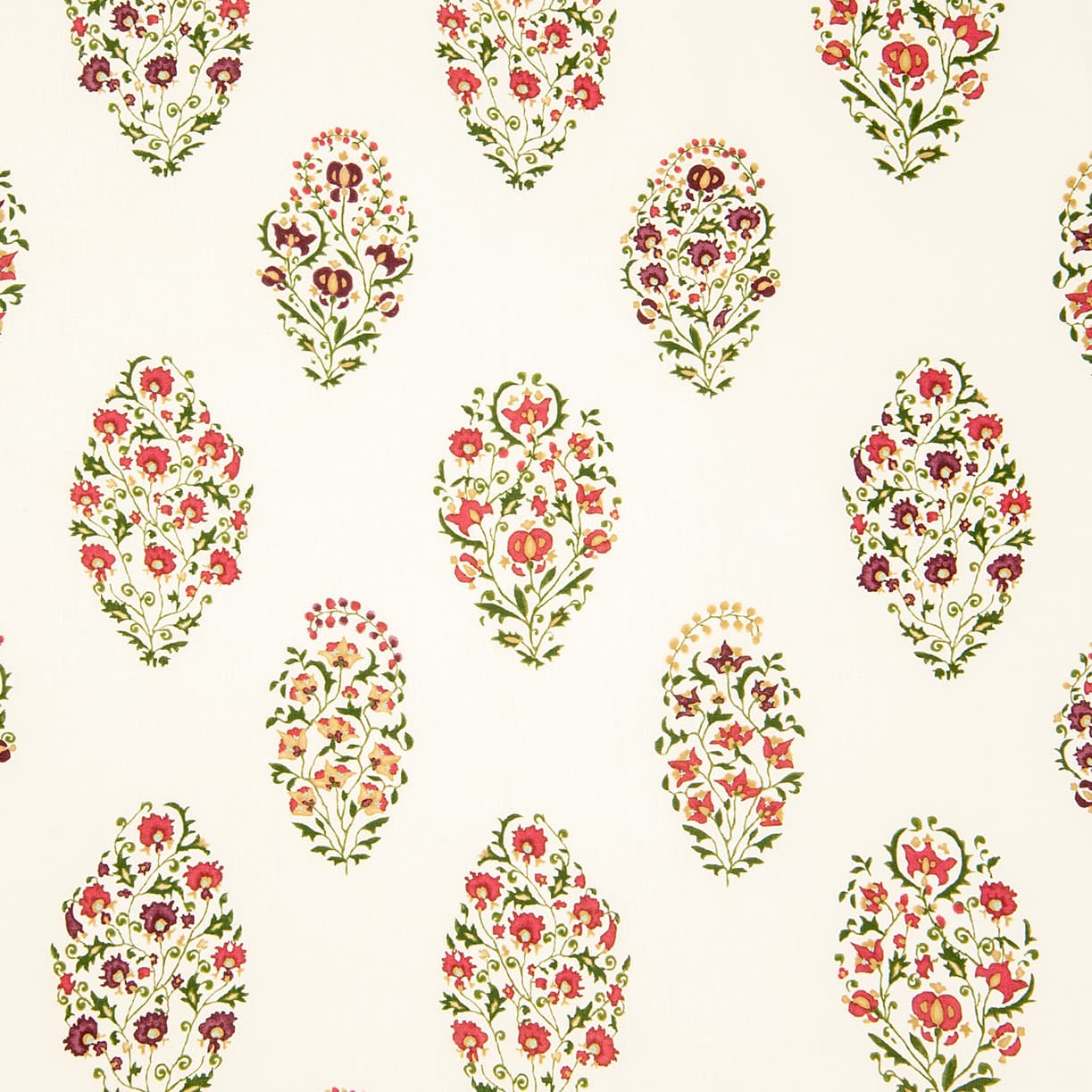 Detail of wallpaper in a floral paisley print in shades of red, purple, yellow and green on a cream field.