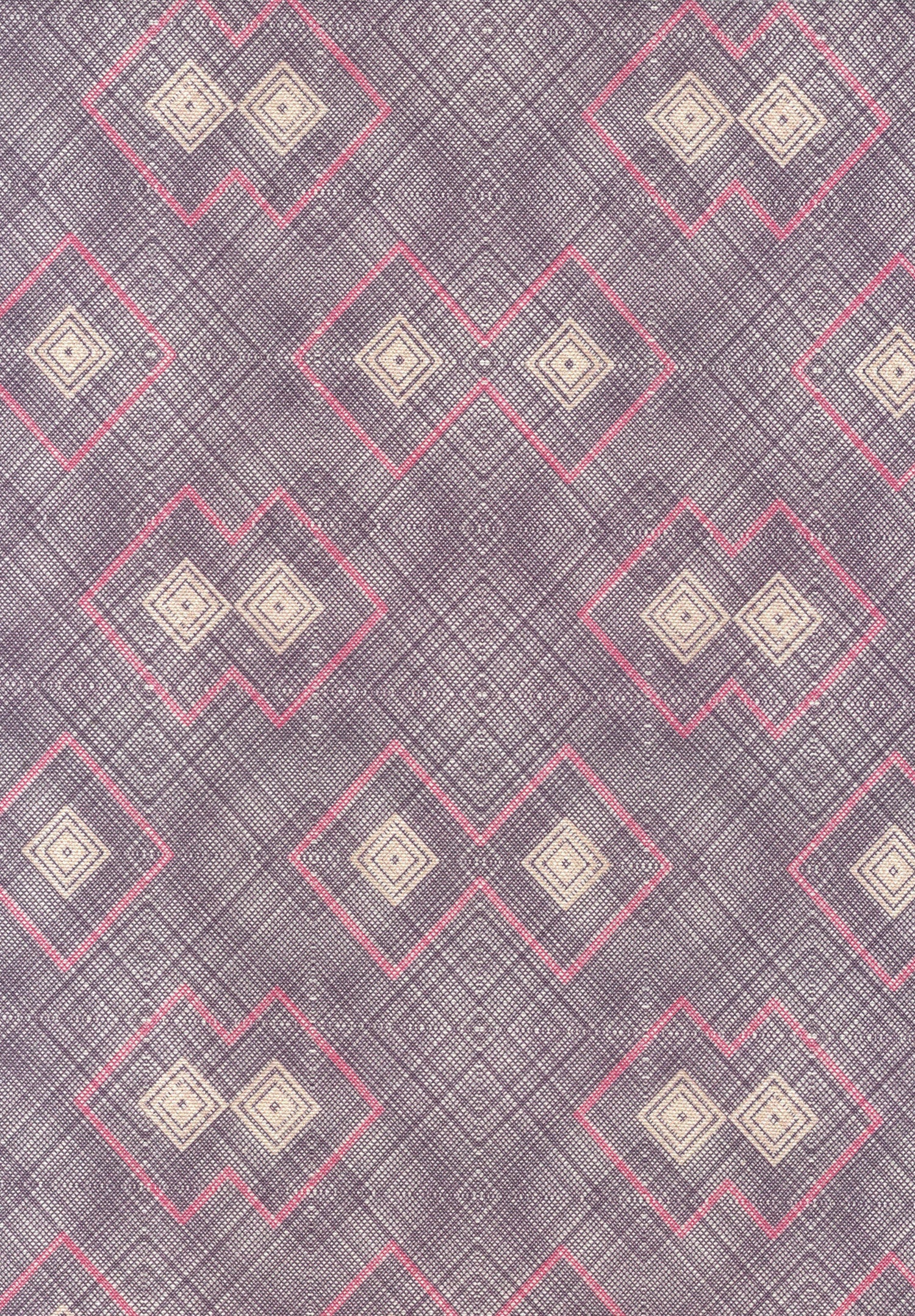 Detail of fabric in a detailed diamond lattice print in shades of pink and tan on a purple field.
