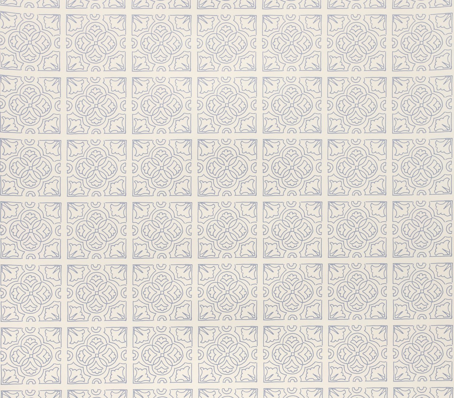 Detail of fabric in a damask lattice print in blue on a cream field.