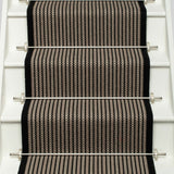 Striped flatweave runner in black and ivory on white staircase