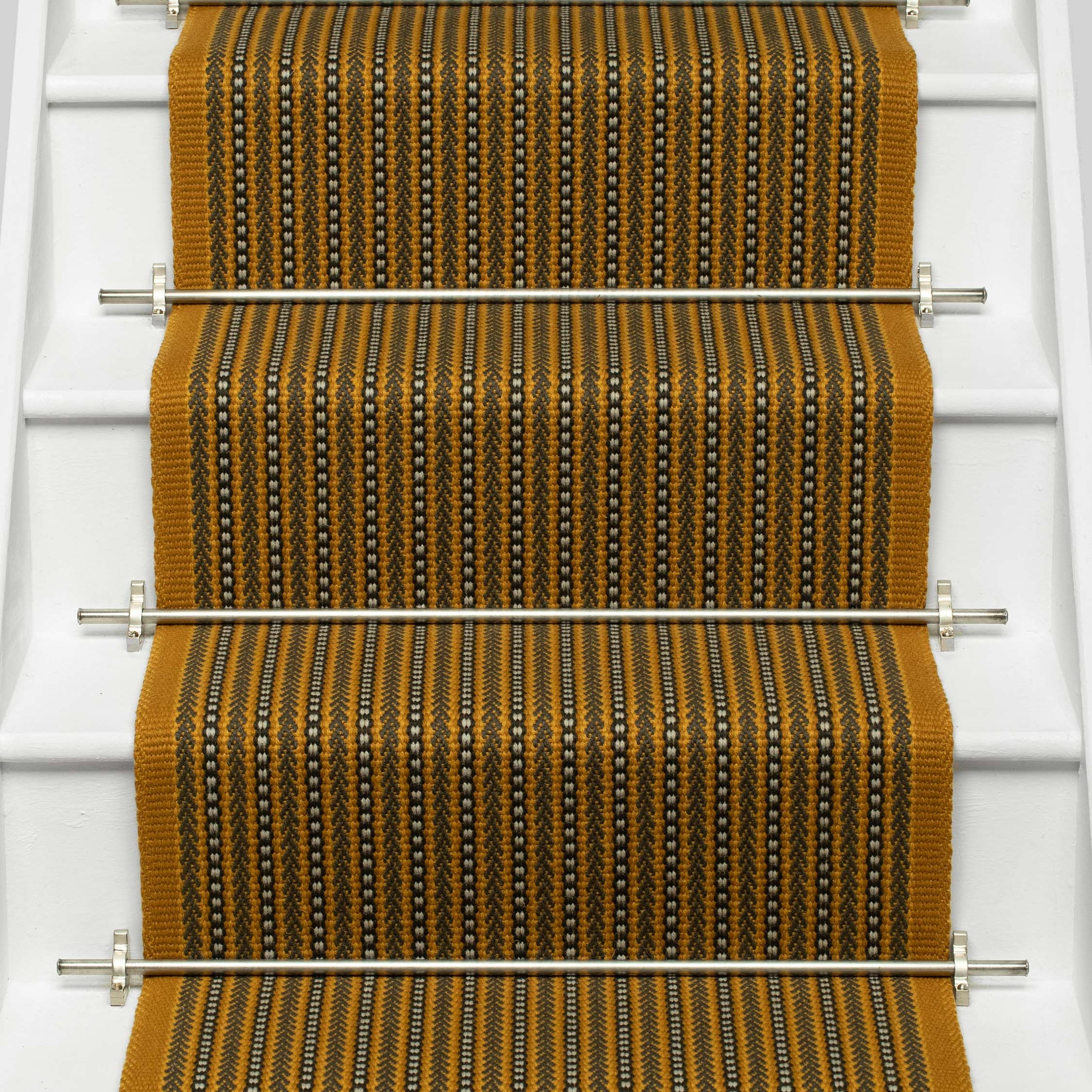 Striped flatweave runner in mustard black and ivory on white staircase