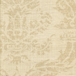 Detail of fabric in a mottled damask print in tan on a cream field.