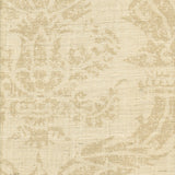 Detail of fabric in a mottled damask print in tan on a cream field.