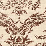 Detail of fabric in a mottled damask print in brown on a cream field.