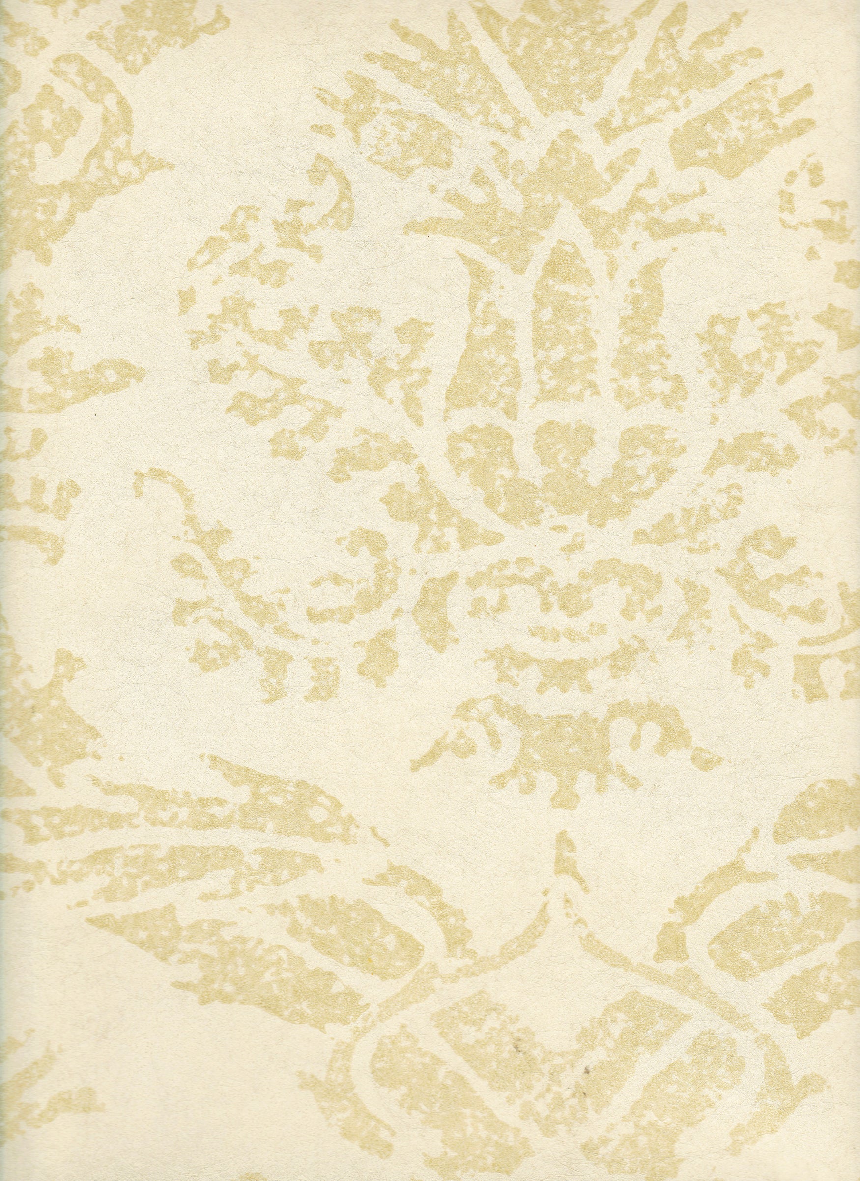 Detail of wallpaper in a mottled damask print in tan on a cream field.