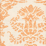 Detail of wallpaper in a mottled damask print in orange on a cream field.