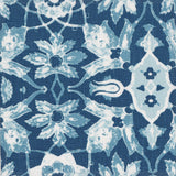 Detail of fabric in a floral damask print in shades of blue and white on a navy field.