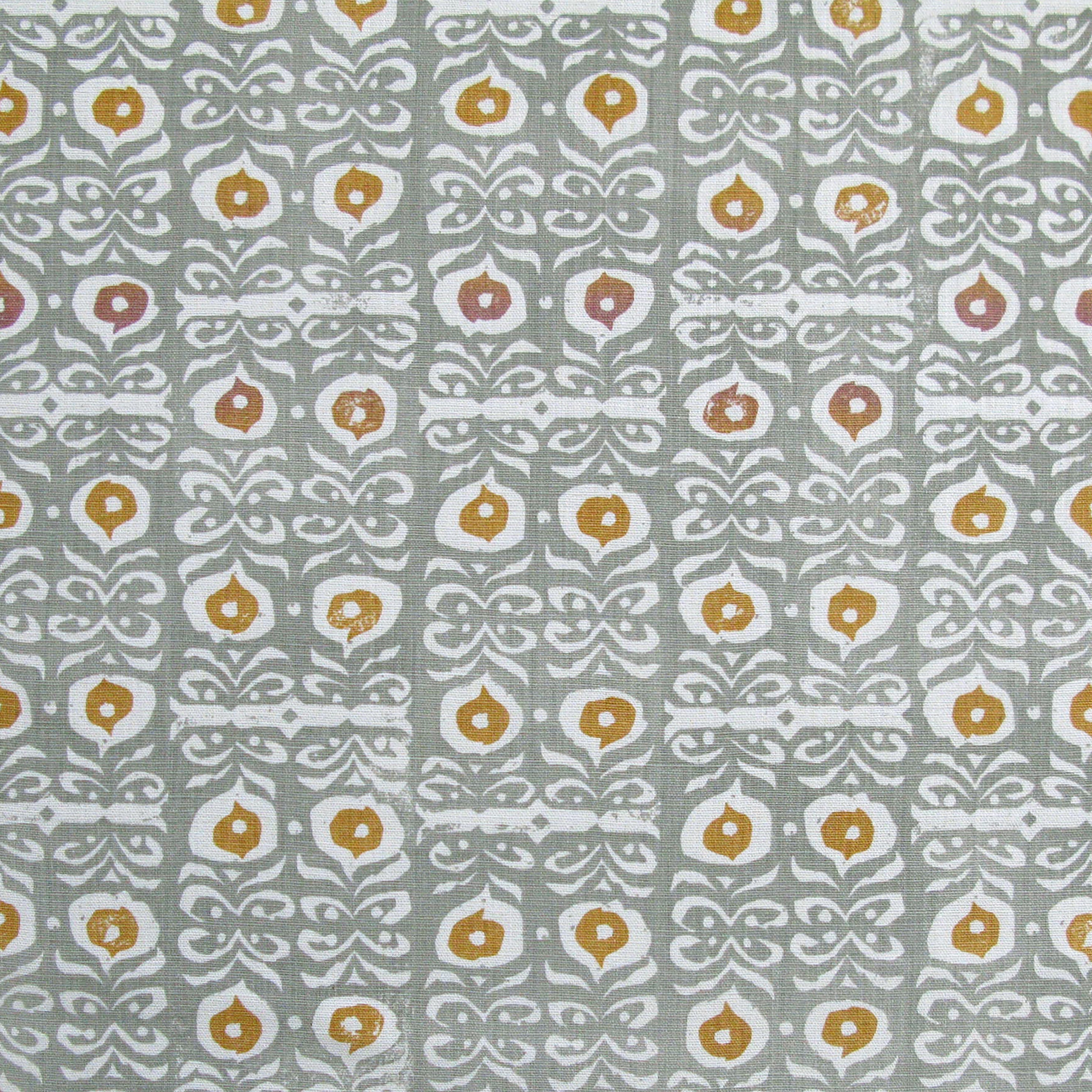 Fabric in a repeating damask print in white and gold on a blue-gray field.