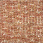 Handwoven rug detail in a contemporary design in orange red and beige