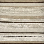 Detail of a flatwoven carpet with tan, beige and brown stripes, with a wide fringed stripe throughout.