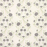 Detail of wallpaper in a floral lattice print in gray, charcoal and green on a cream field.