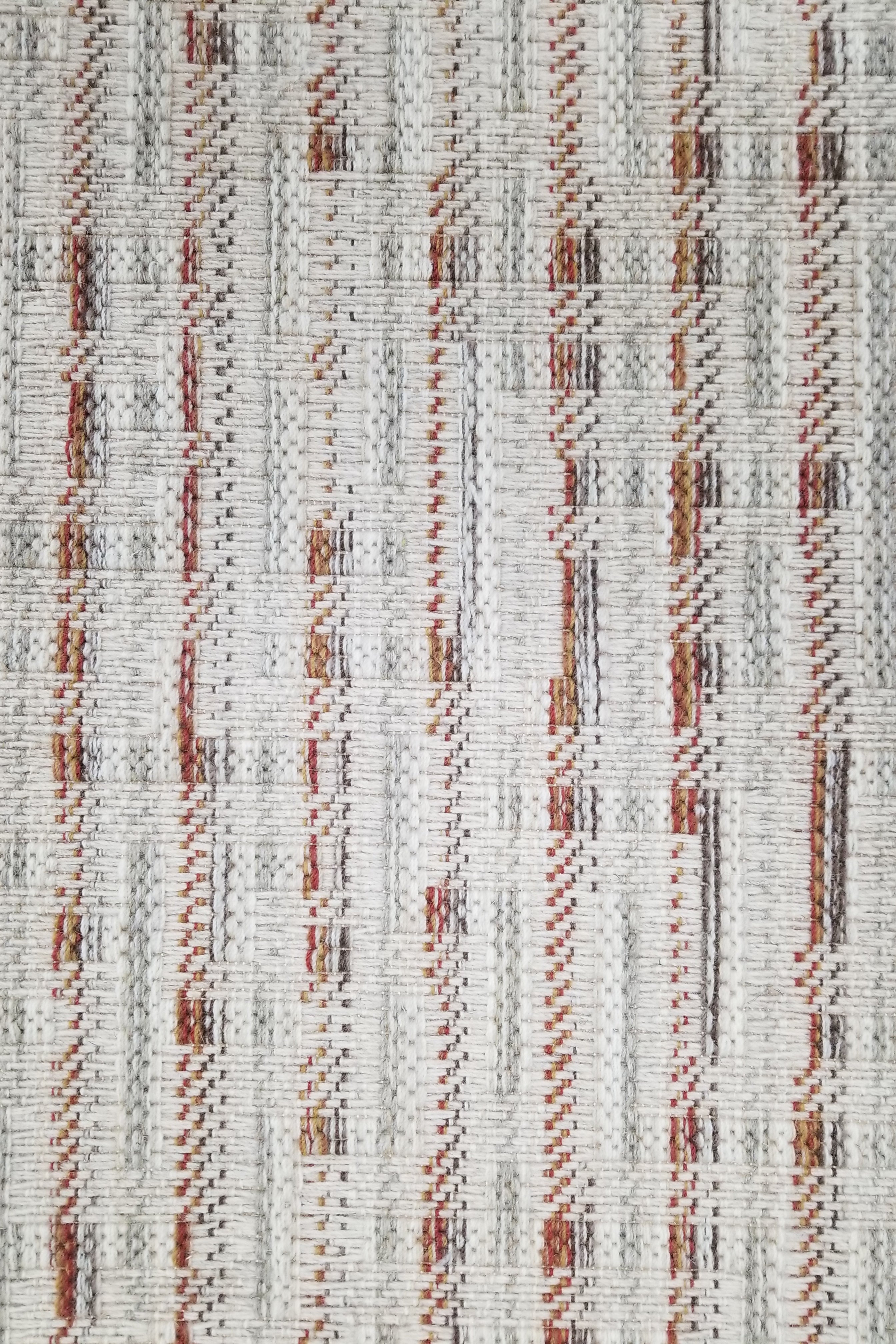 Textured carpet with vertical stripes in brown, gray, and beige on a white background