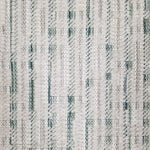 Textured broadloom carpet with green and grey stripes