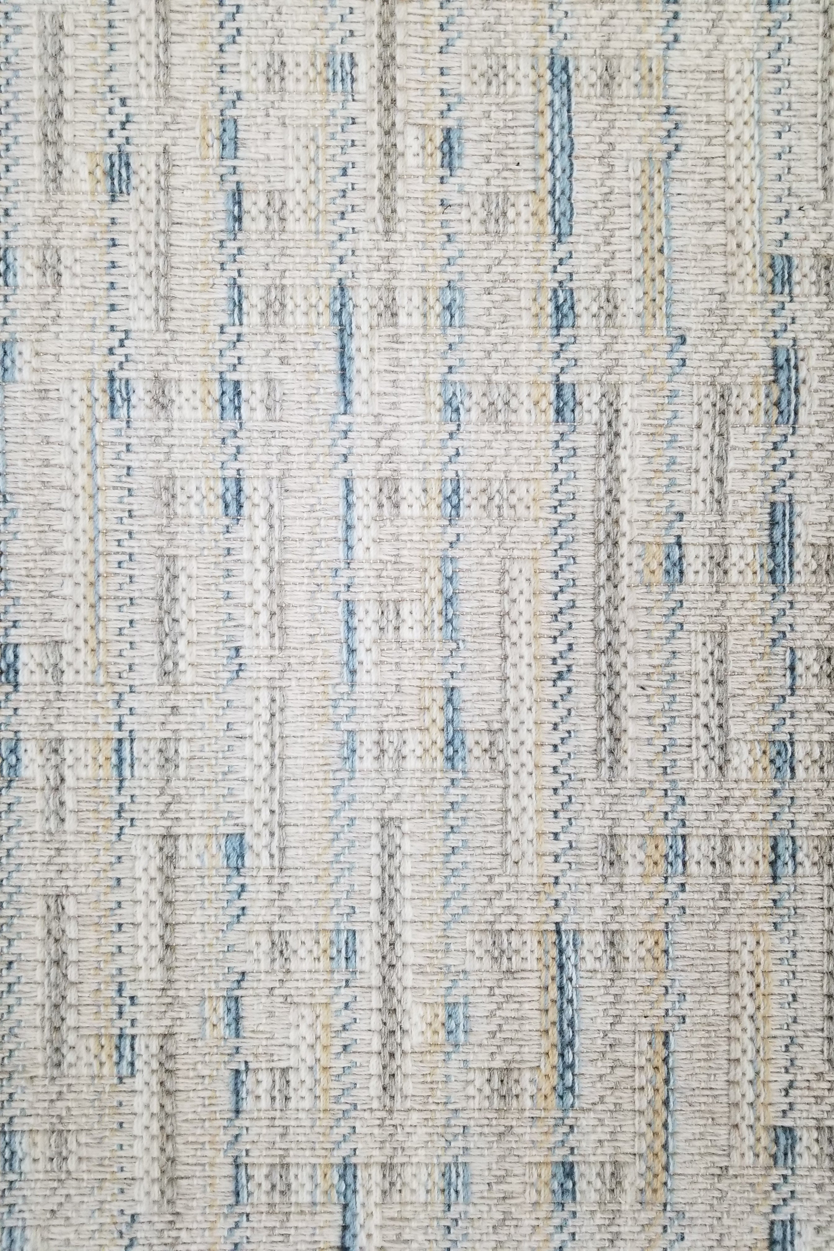 Textured broadloom carpet with blue and grey stripes