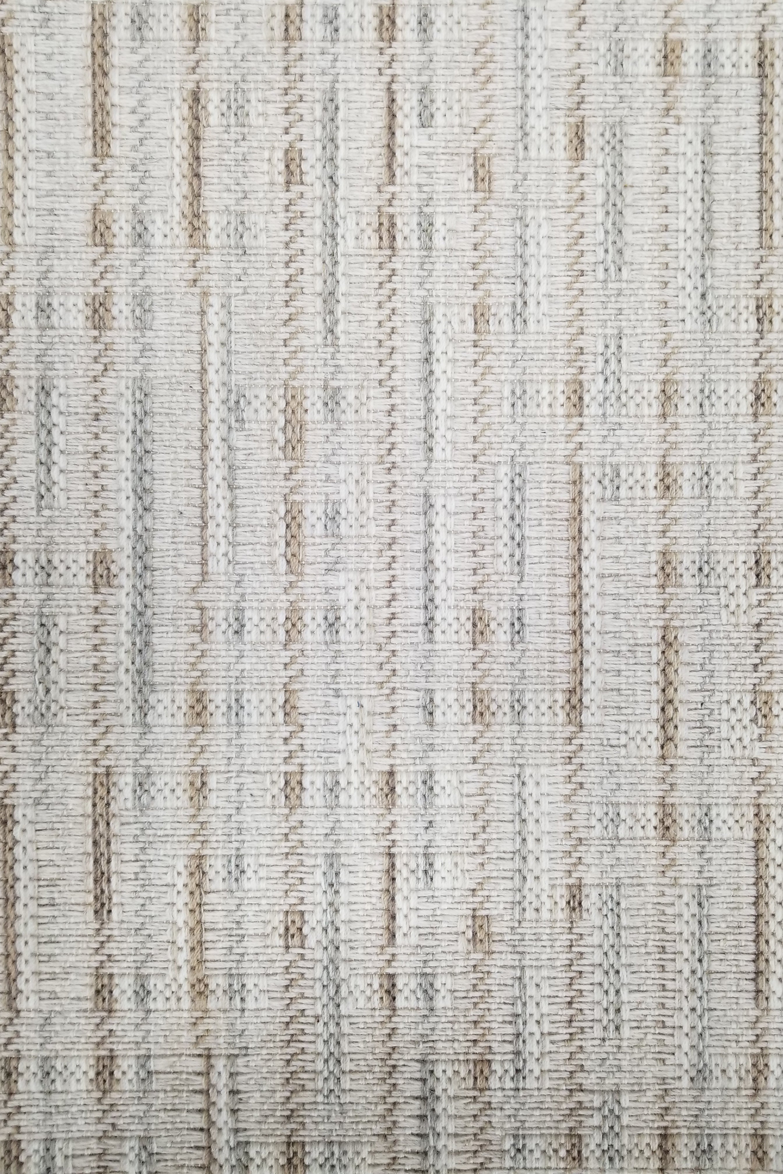 Textured broadloom carpet with grey and taupe stripes.
