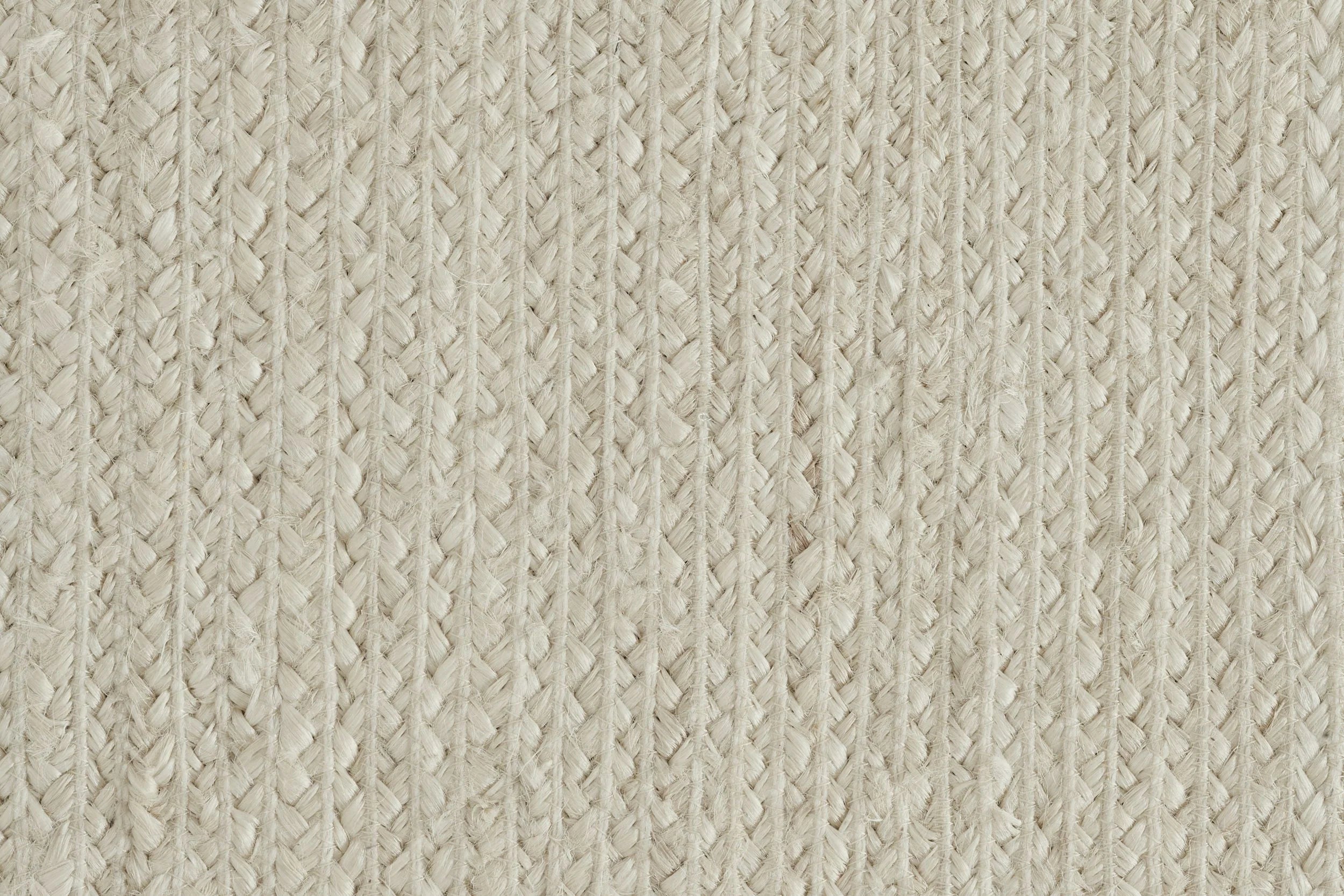 Broadloom carpet sample in braided texture in ivory.
