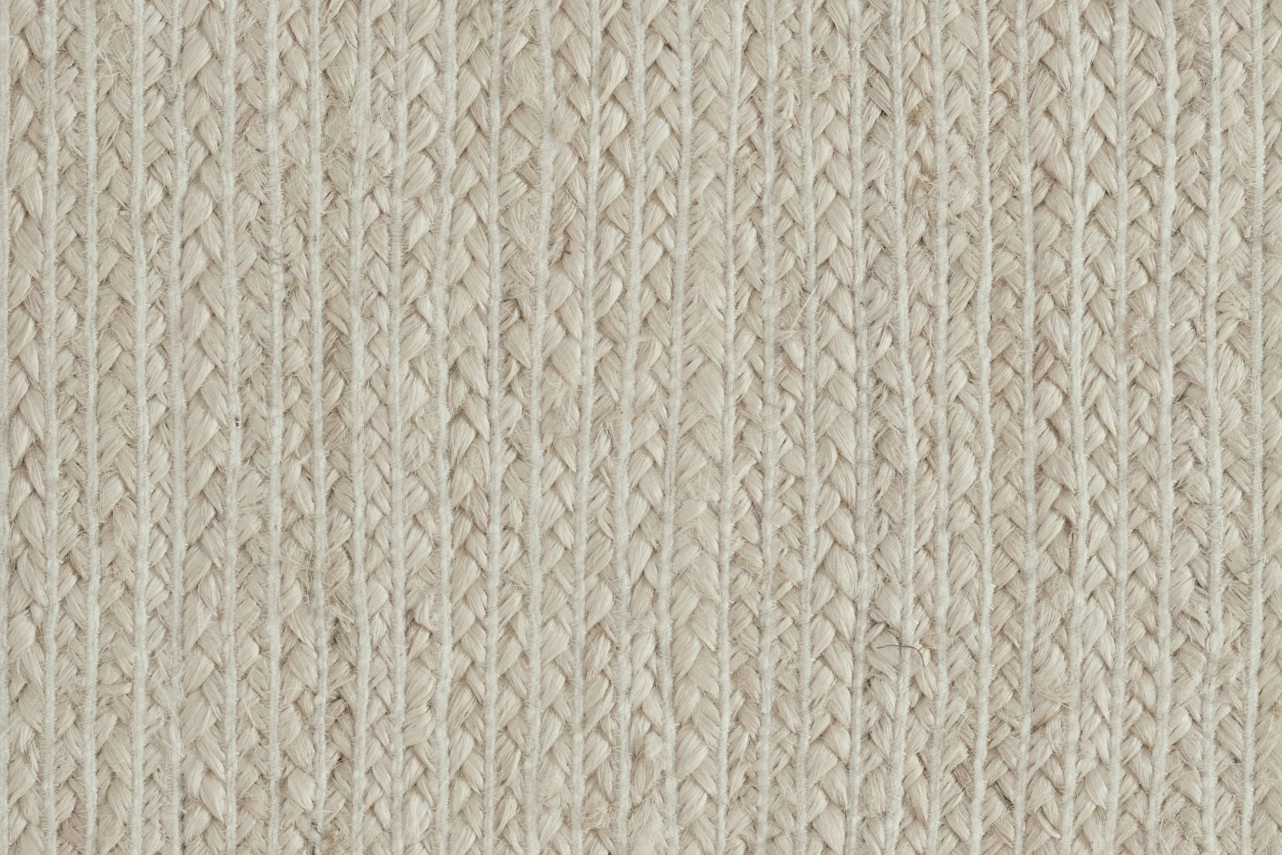Broadloom carpet sample in braided texture in white. 