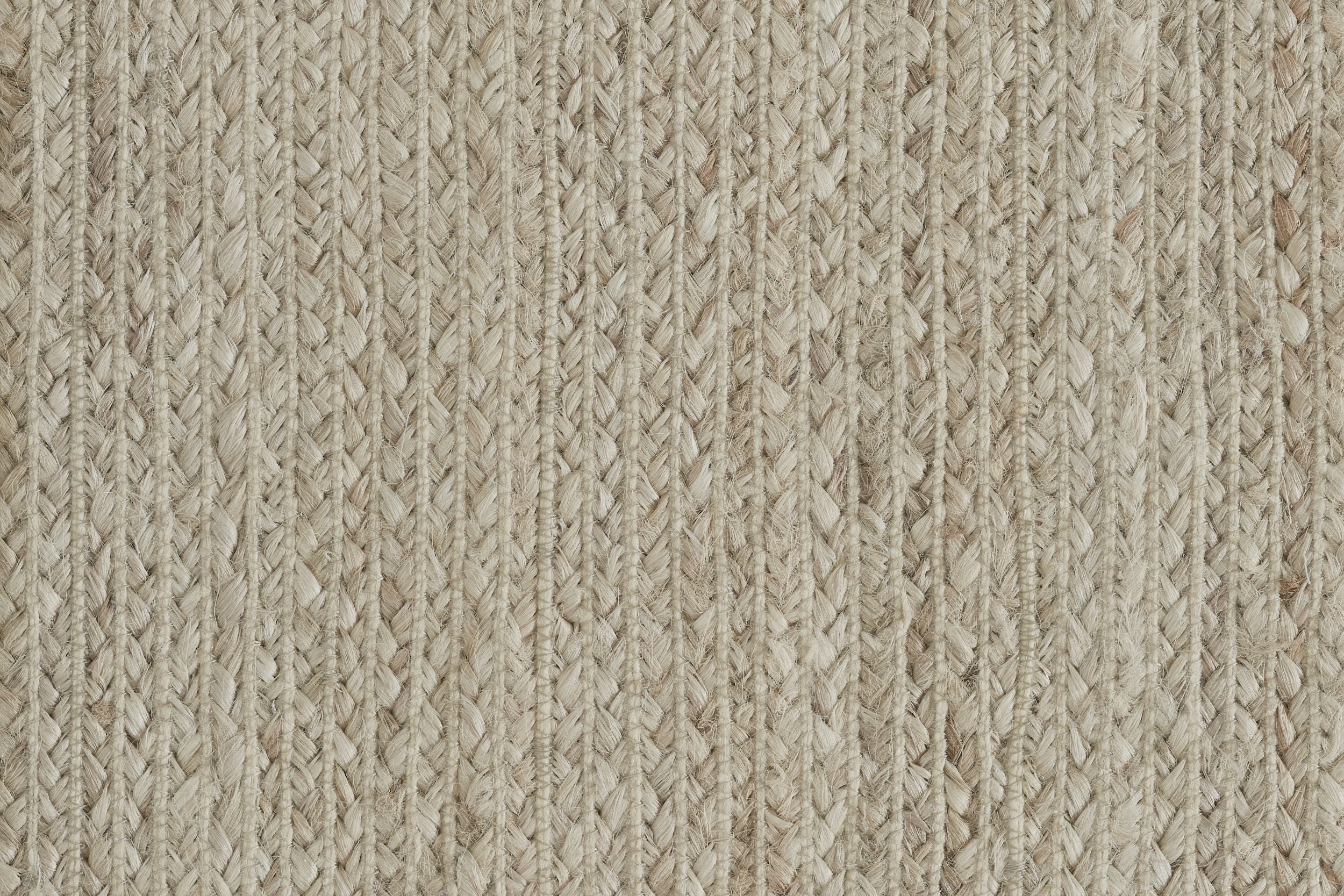 Broadloom carpet sample in braided texture in ecru.