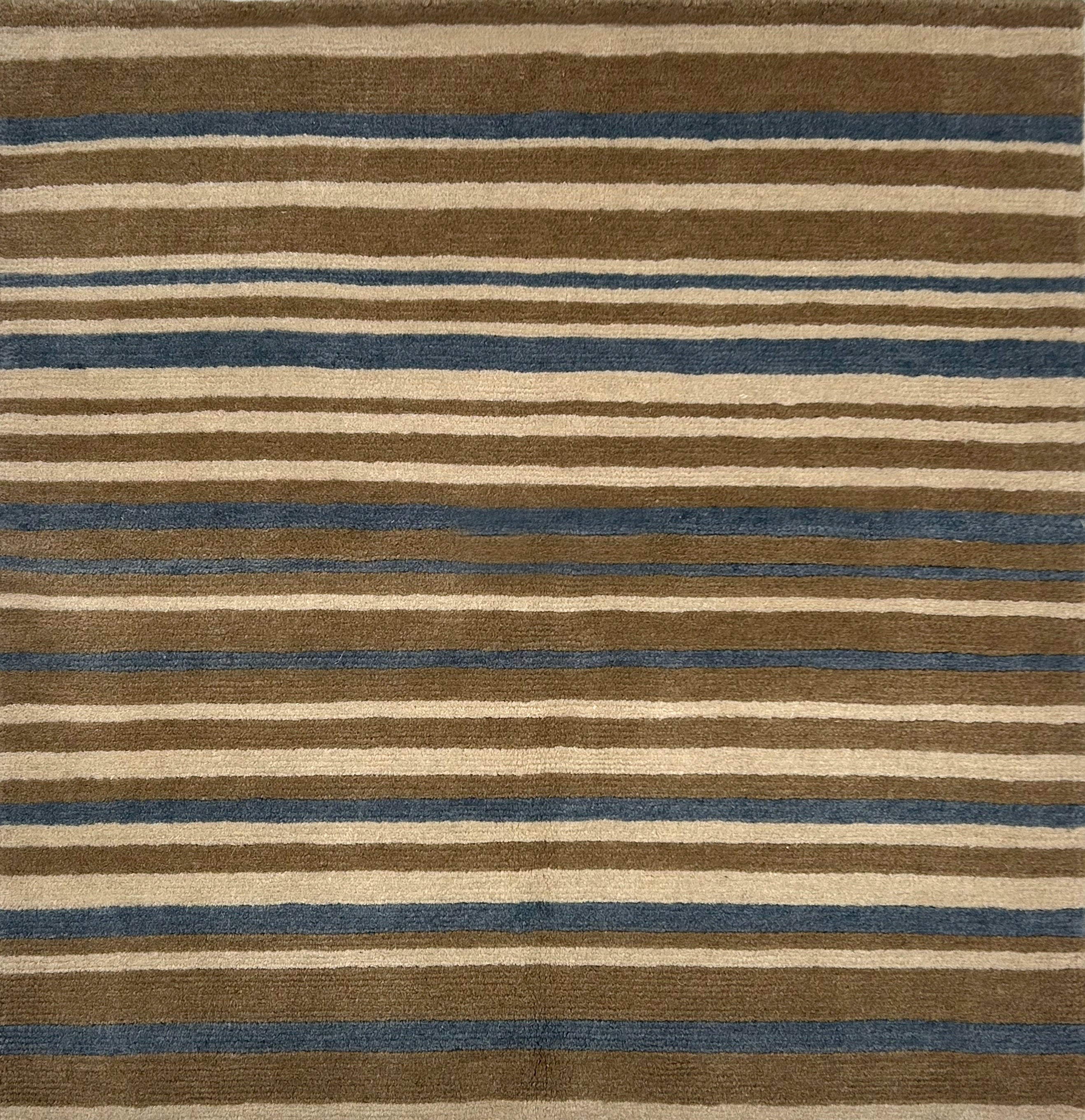 Handknotted rug in striped design in brown, grey and cream