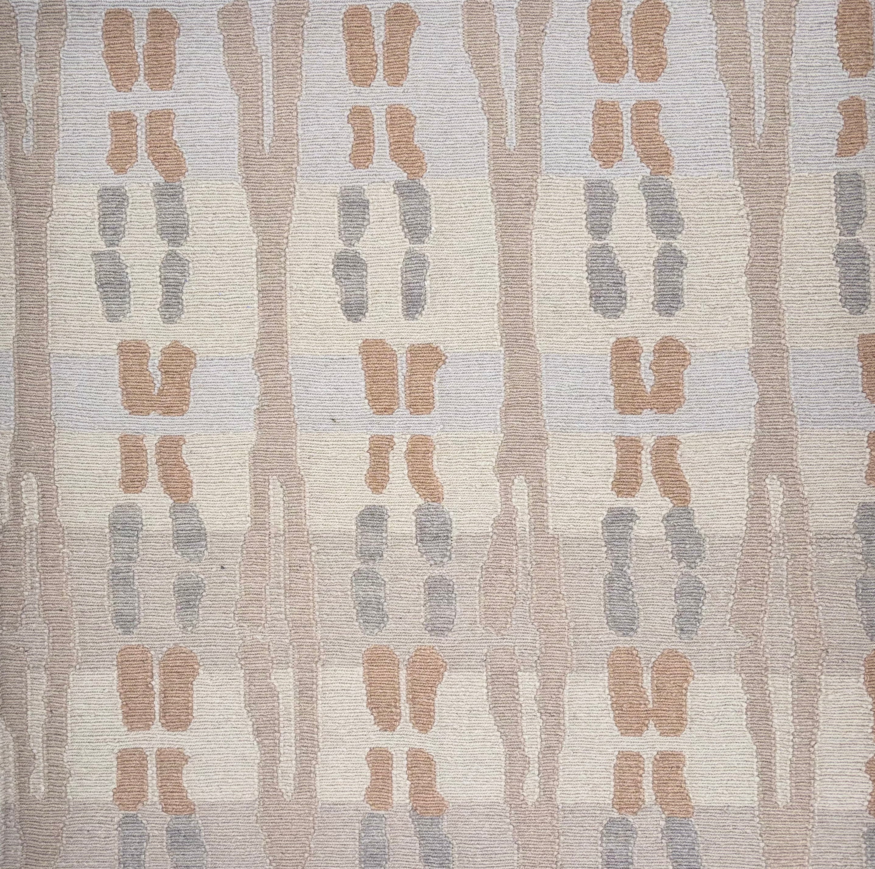 Handknotted rug sample in a abstract stripe design in shades of tan, cream and grey.