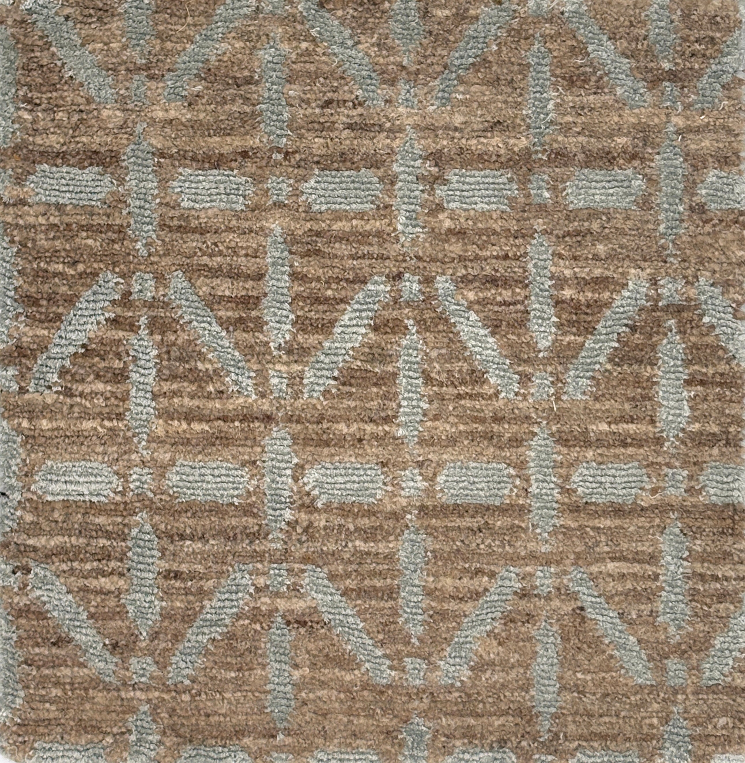 Handknotted rug with grey linear design on a heather brown field. 