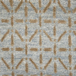 Handknotted rug with tan linear design on a light blue field. 
