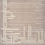 Detail of a contemporary rug with an taupe ground and a mix of thin lines and long slender rectangles in cream