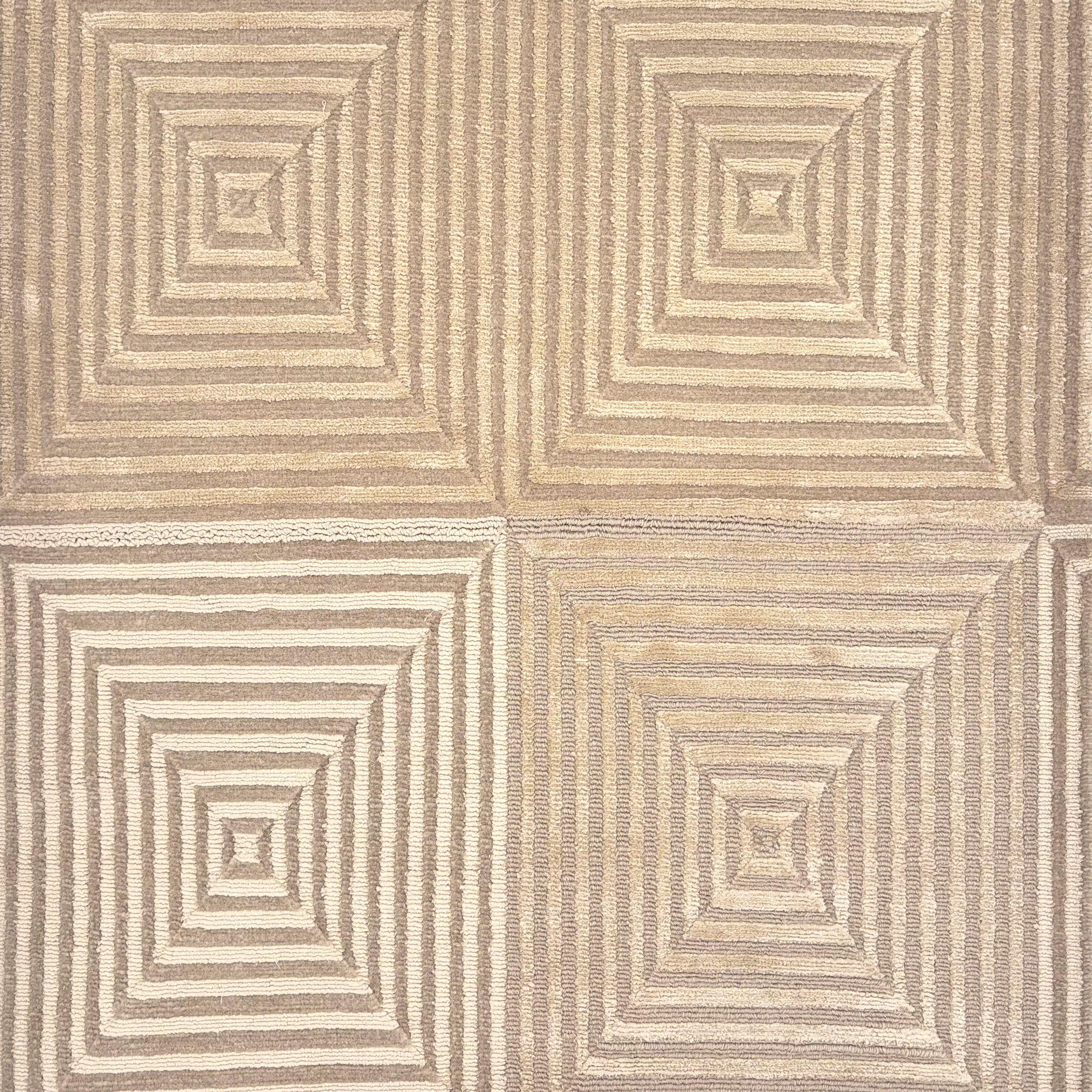 Handknotted rug sample in a nested repeating square motif in shades of taupe.