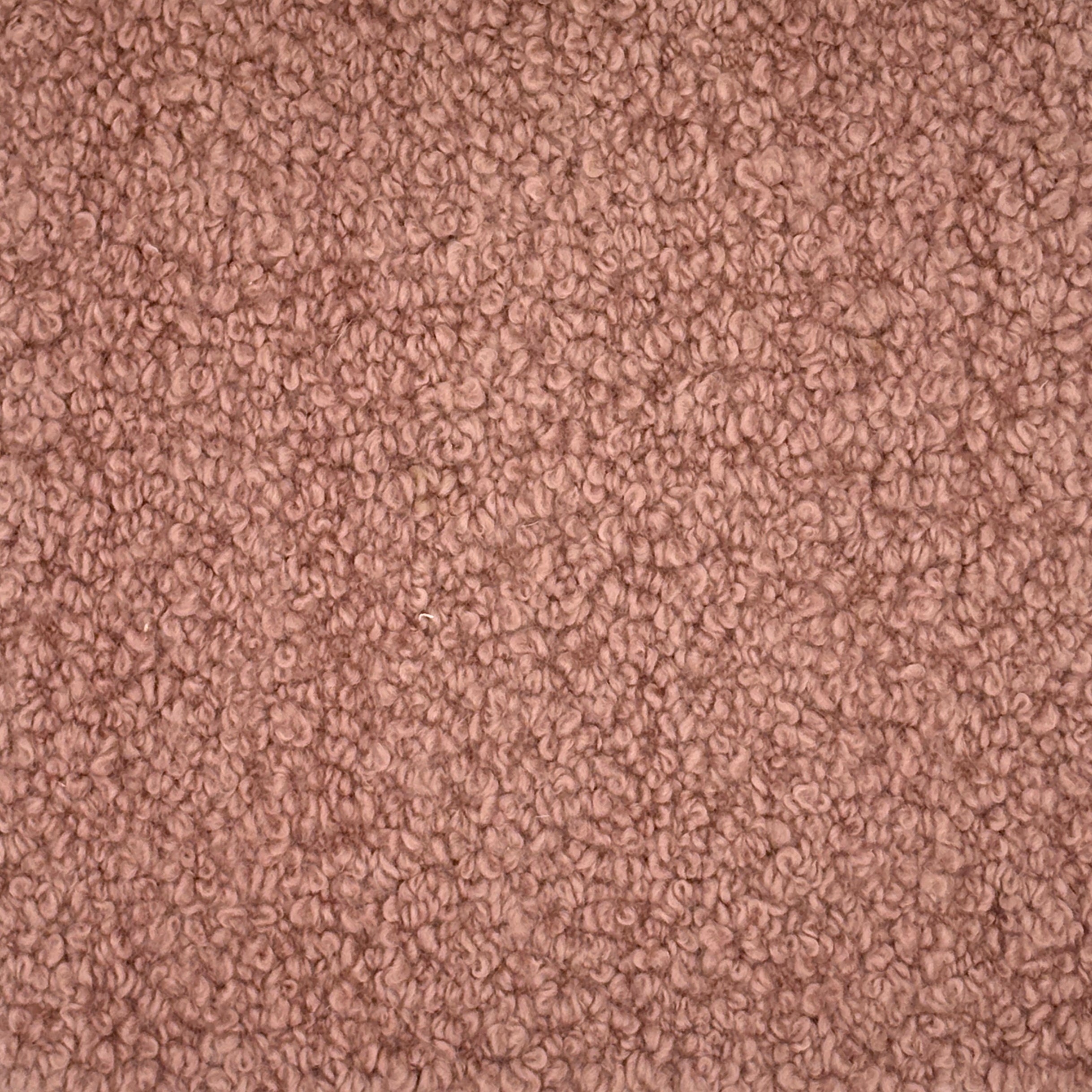 Close up of a blush bouclé carpet