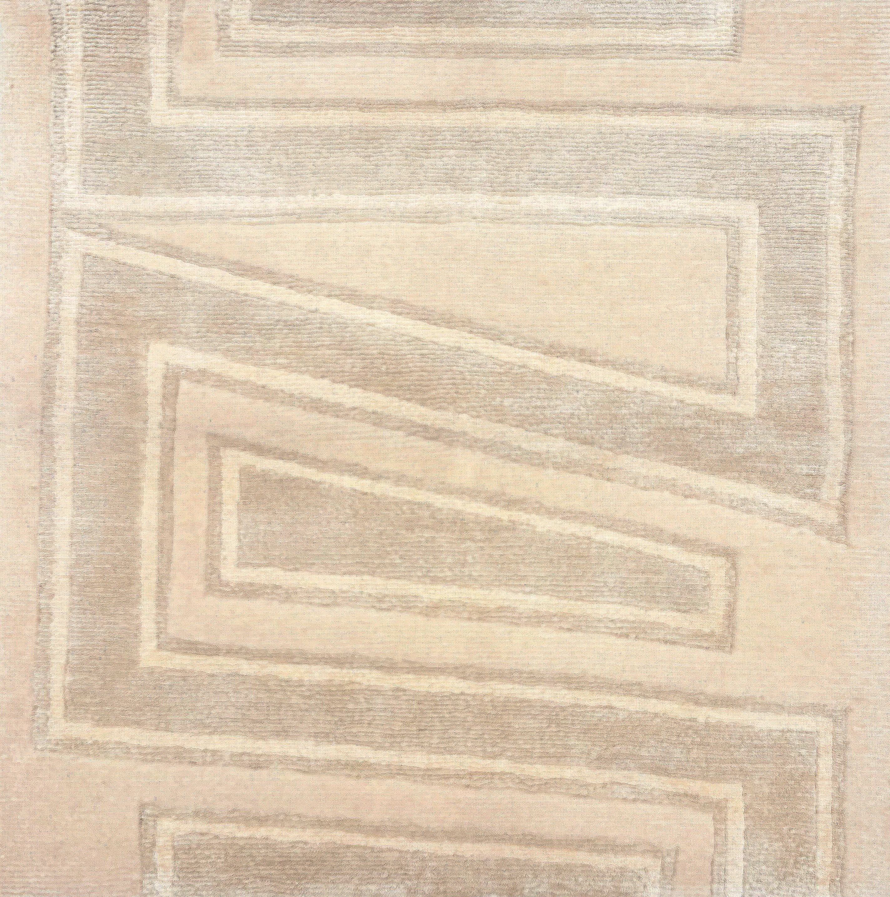 Handknotted rug sample in a large scale zig zag stripe in tonal shades of cream.