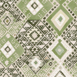 Detail of fabric in a painterly diamond print in shades of green, gray and white.