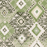 Detail of fabric in a painterly diamond print in shades of green, gray and white.