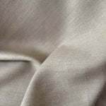 Close-up of beige fabric with a slight texture