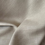 Close-up of beige fabric with a slight texture