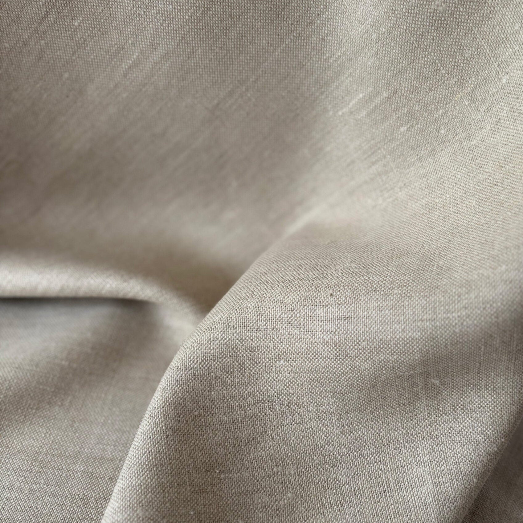 Close-up of beige fabric with a slight texture