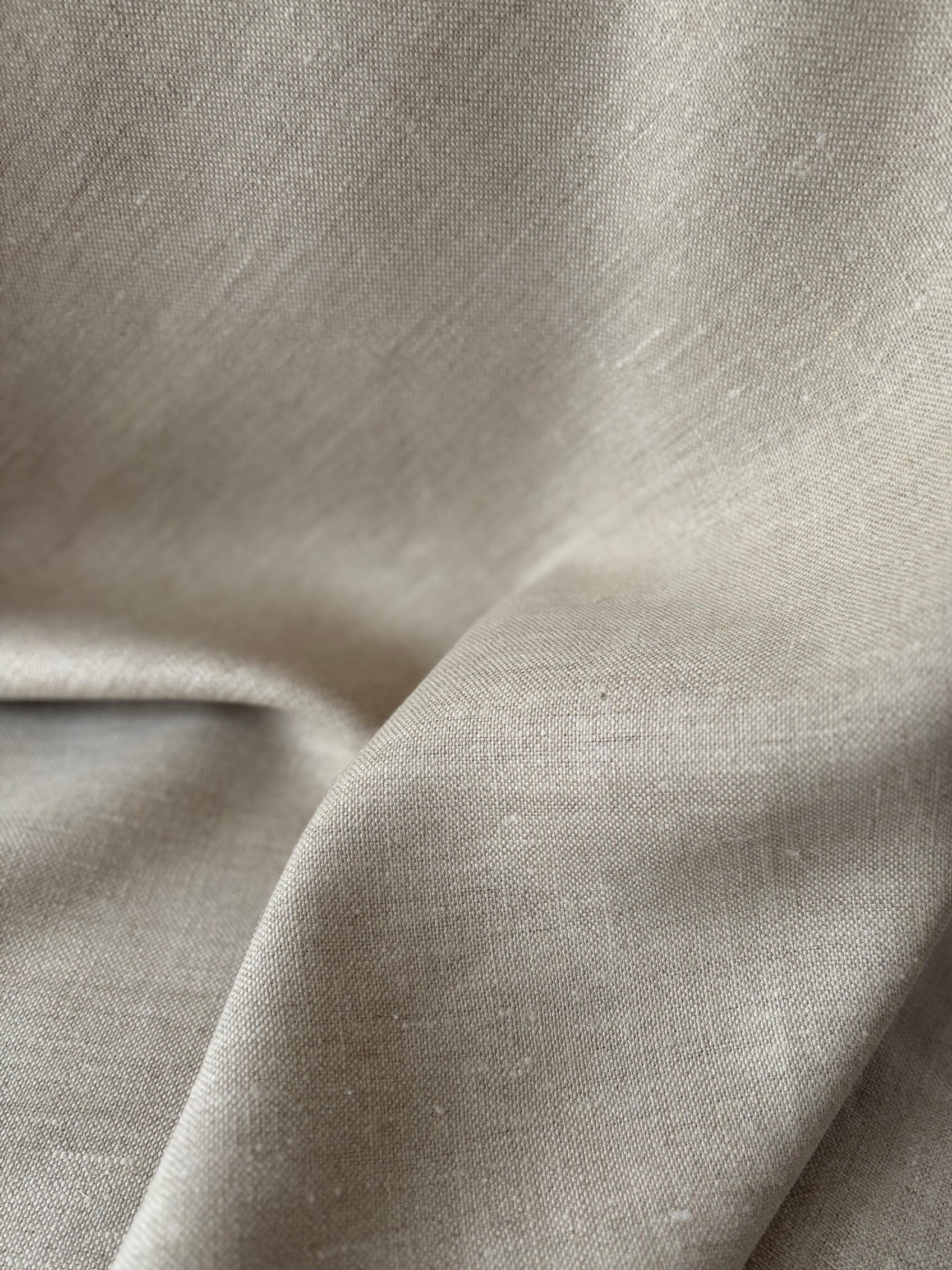 Close-up of beige fabric with a slight texture