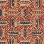 Detail of fabric in a dense geometric print in shades of navy and rust on a tan field.