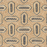 Detail of fabric in a dense geometric print in shades of navy and tan on a cream field.