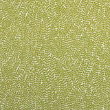 Detail of fabric in a scrolling stem and leaf print in lime on a cream field.