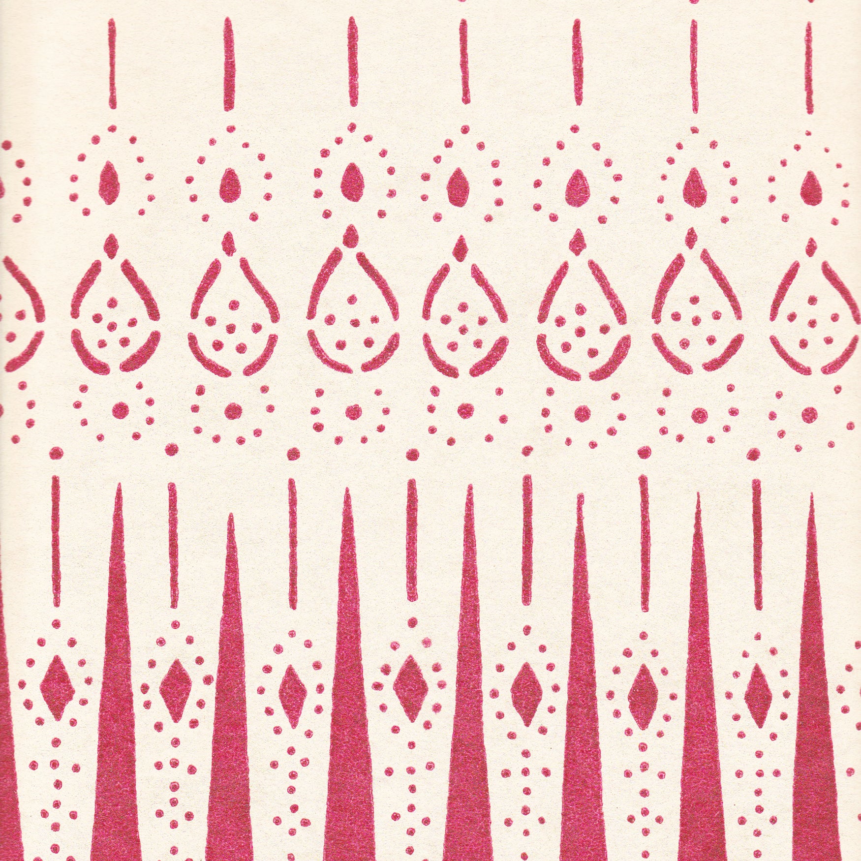 Detail of wallpaper in a bordered teardrop print in dark pink on a cream field.