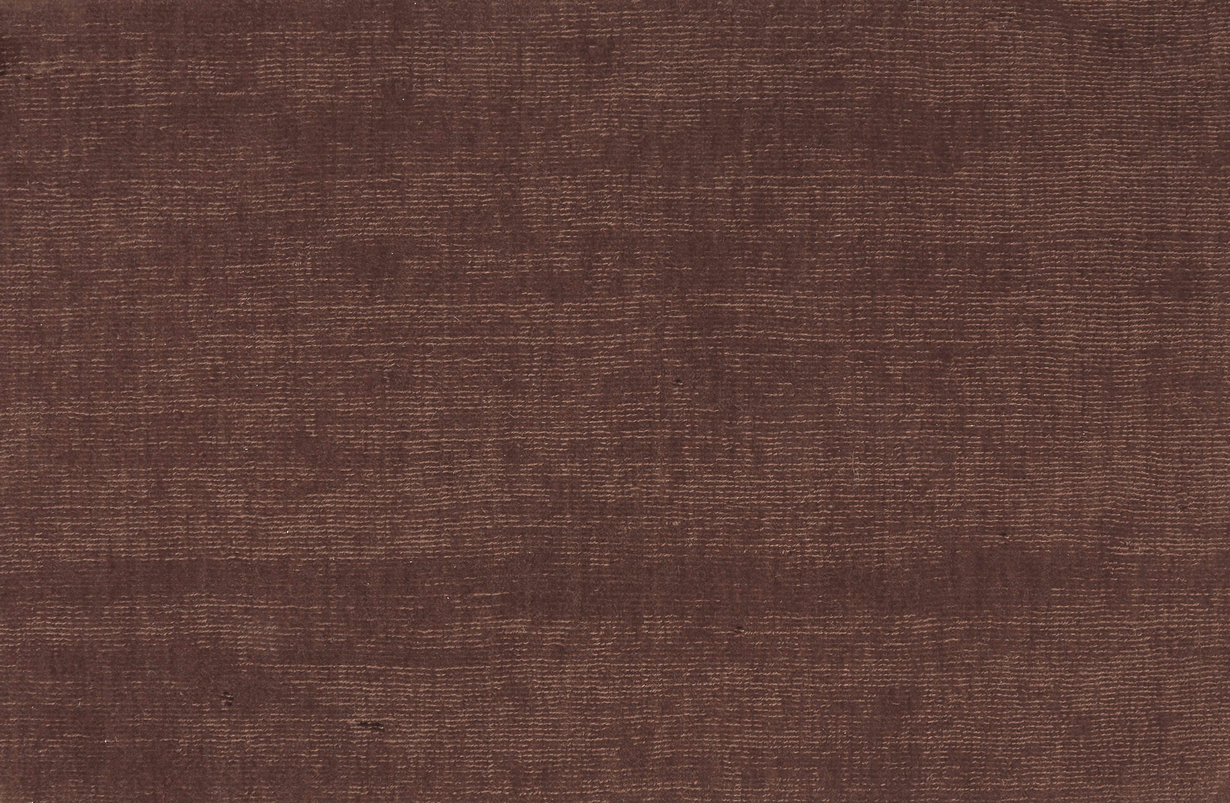 Solid broadloom carpet in maroon.