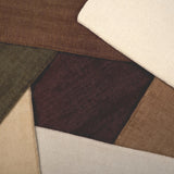 Broadloom carpet samples in an array of solid colors. 