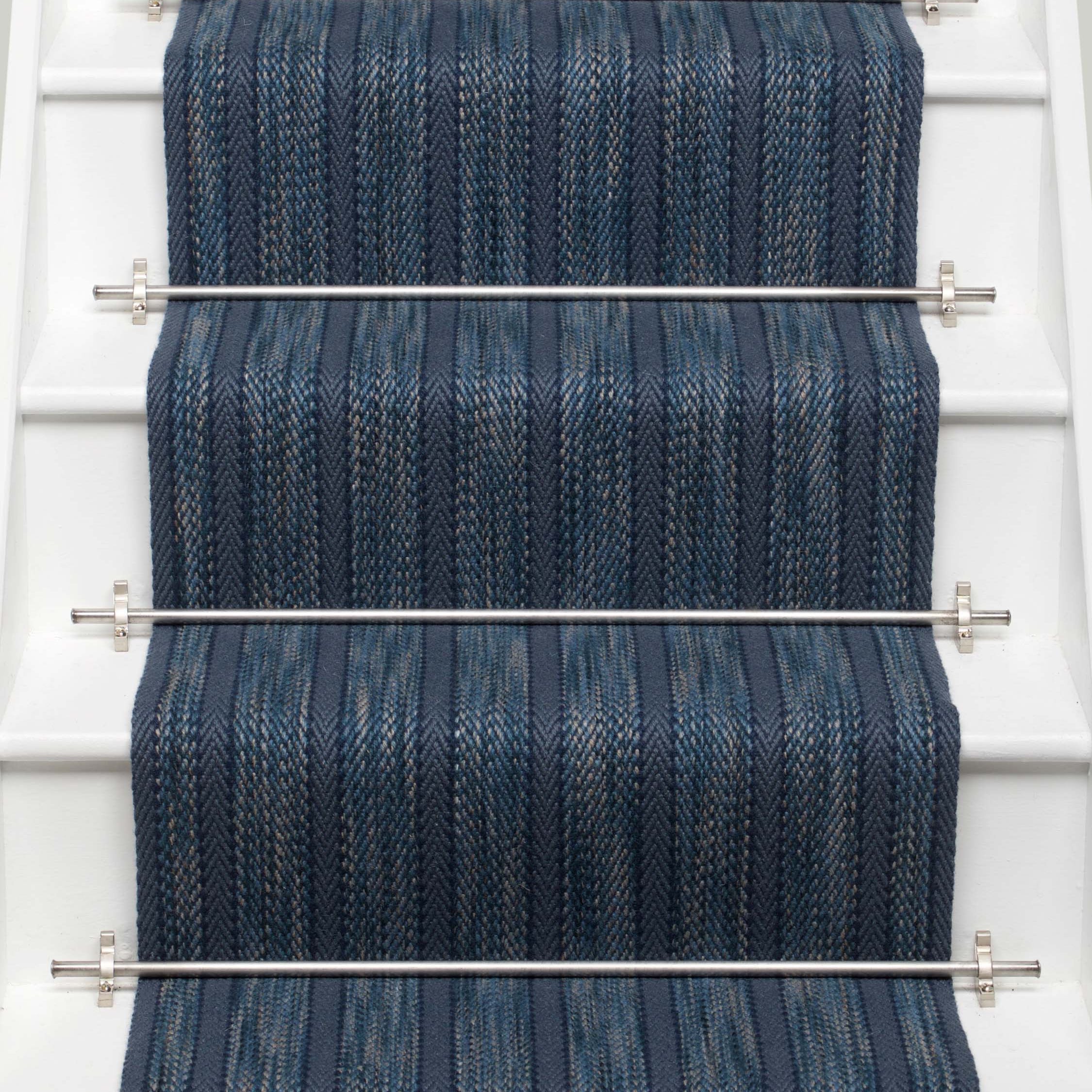 Striped flatweave runner in blue on white staircase