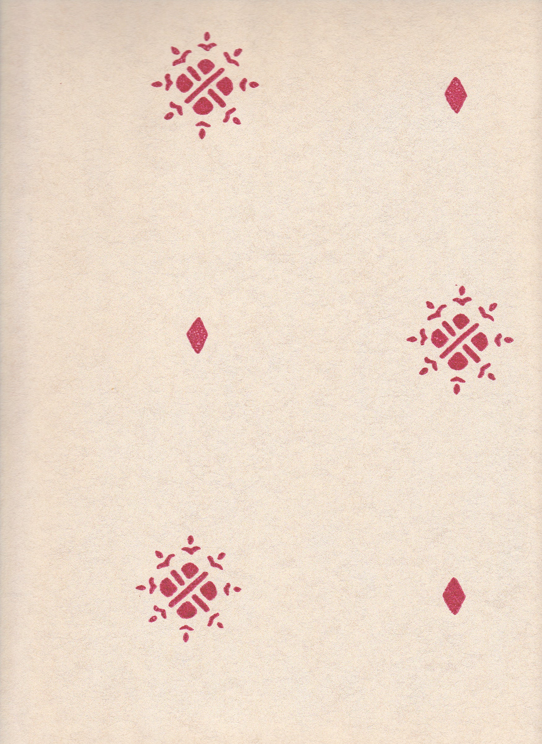 Detail of wallpaper in a repeating geometric starburst print in dark pink on a cream field.