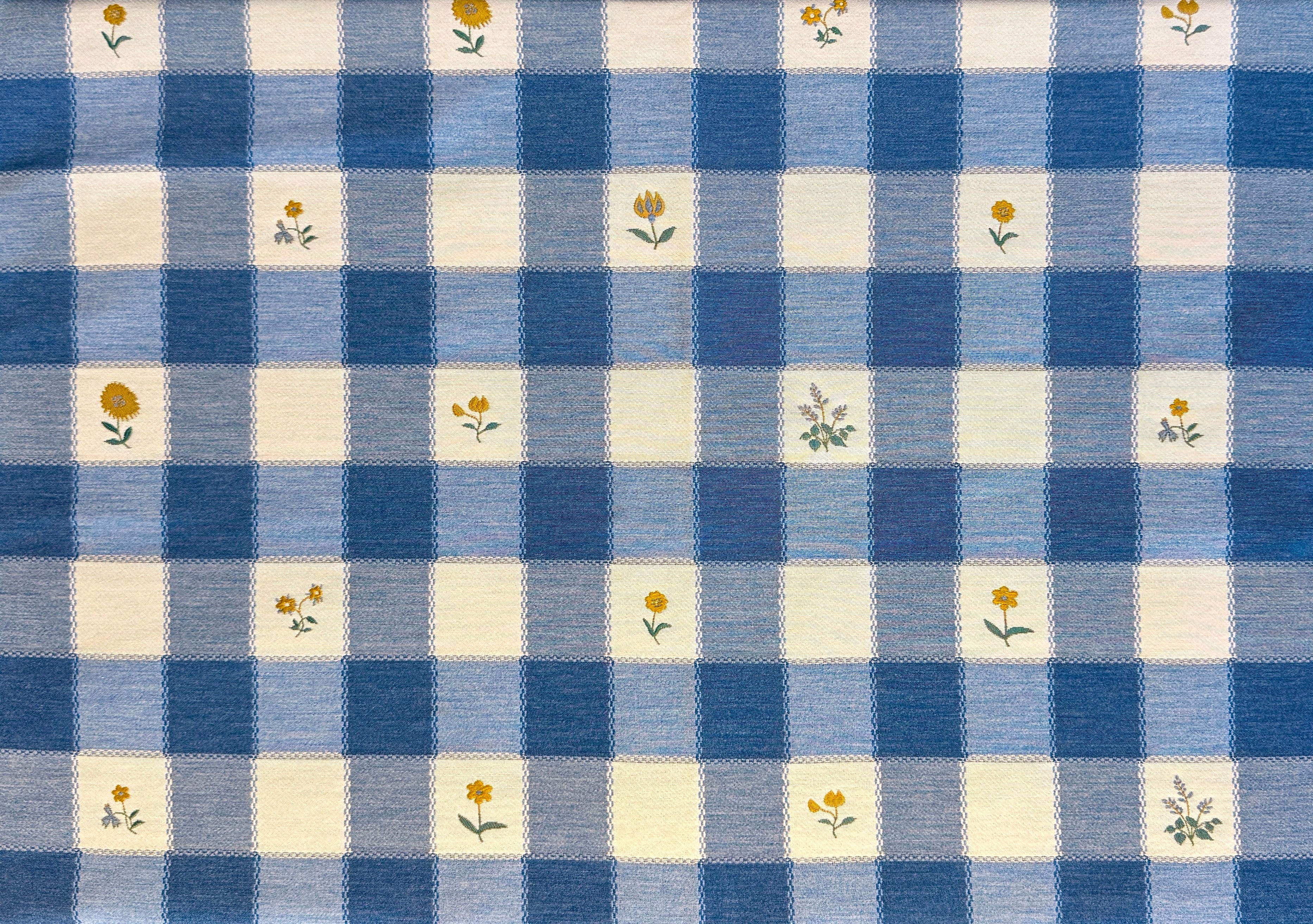 Blue and white checkered fabric with small yellow floral patterns