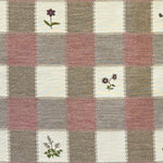 Blush and cream checkered fabric with floral patterns in alternating square