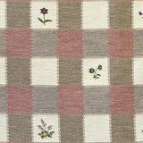 Blush and cream checkered fabric with floral patterns in alternating square